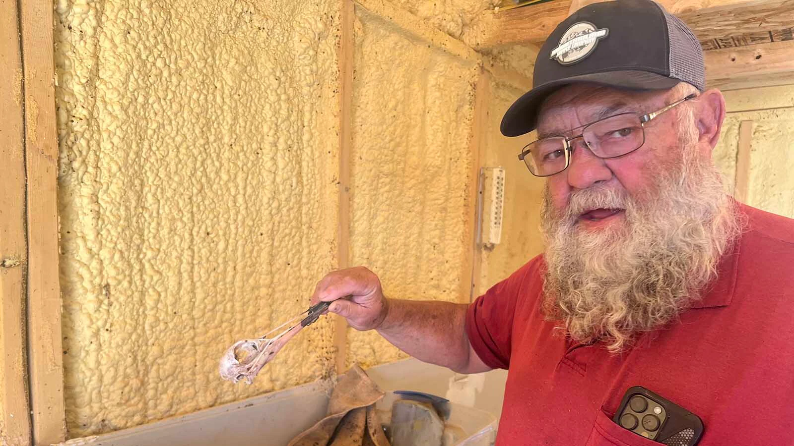 Charlie Stickney holds a sandhill crane skull that was stripped clean of flesh by beetles at C&J’s Bug Barn in Thermopolis.