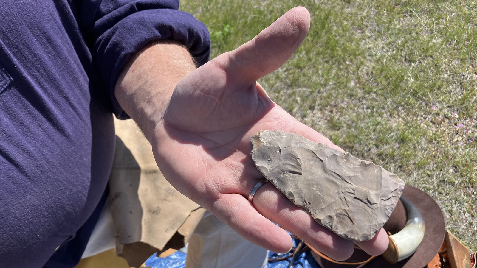 A piece of rock being worked into something that could be used for a spear.