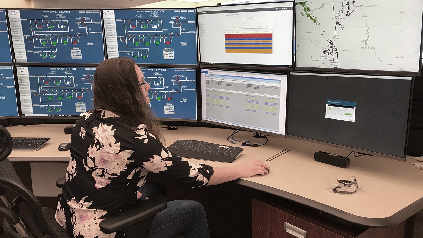 Anna Haneline, program manager for Flowstate, monitors pipeline activity in a control room where the startup’s artificial intelligence software is helping make the system safer.
