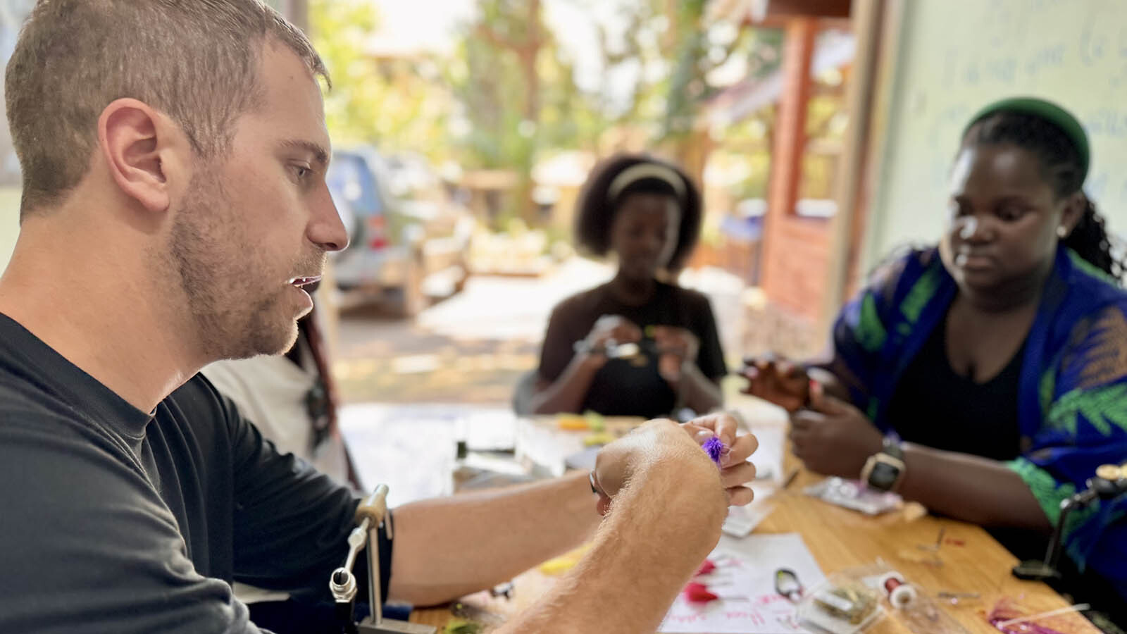 Lucas Rowley and staff at Rescue River work at their craft of making high-end fishing flies.