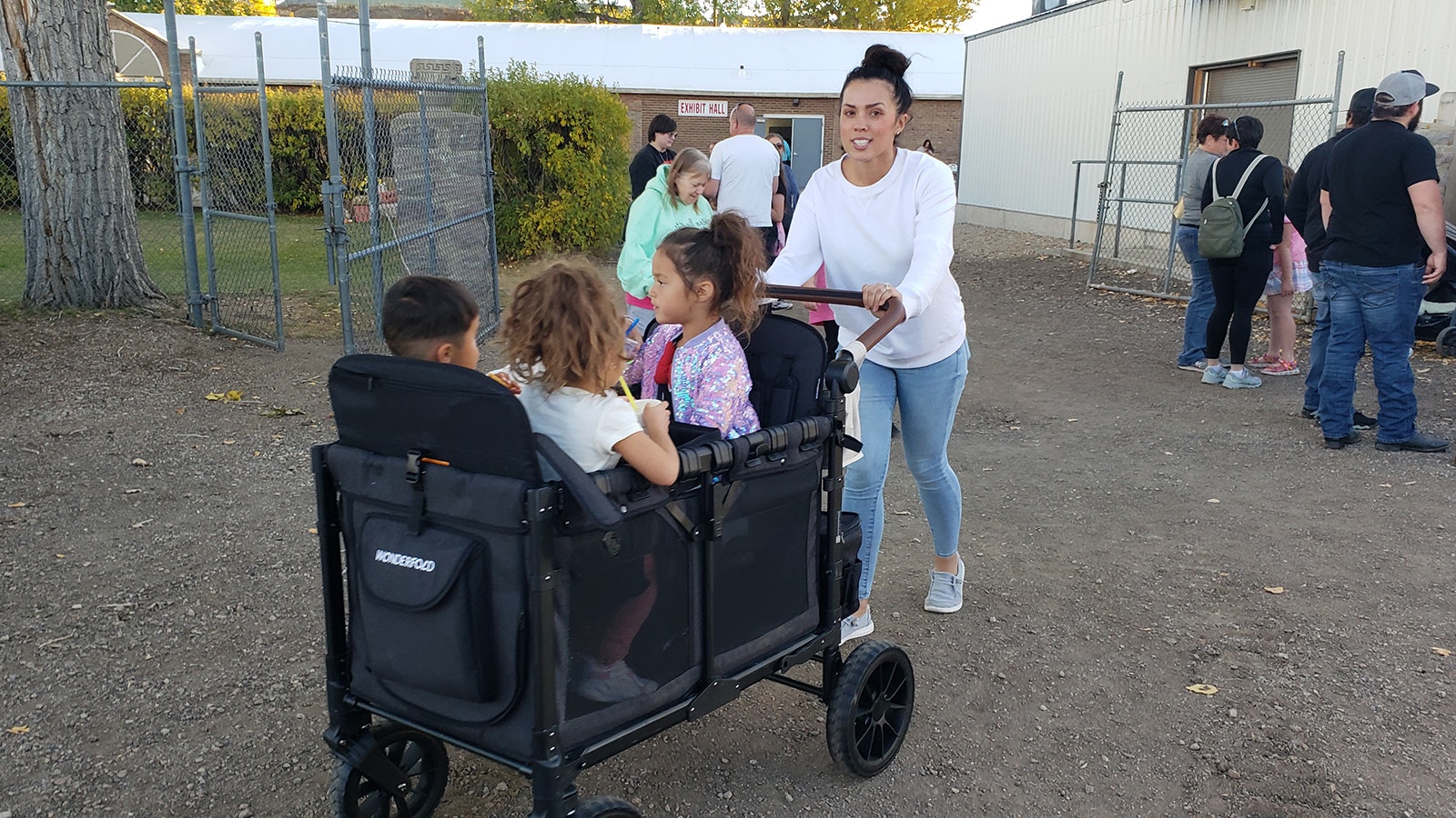 Natasha Martinez pushes a cart full of children at the recent Taste of Wyoming Food Truck Festival and Vendor Showcase. The kids all got drinks from Ohana Sips.