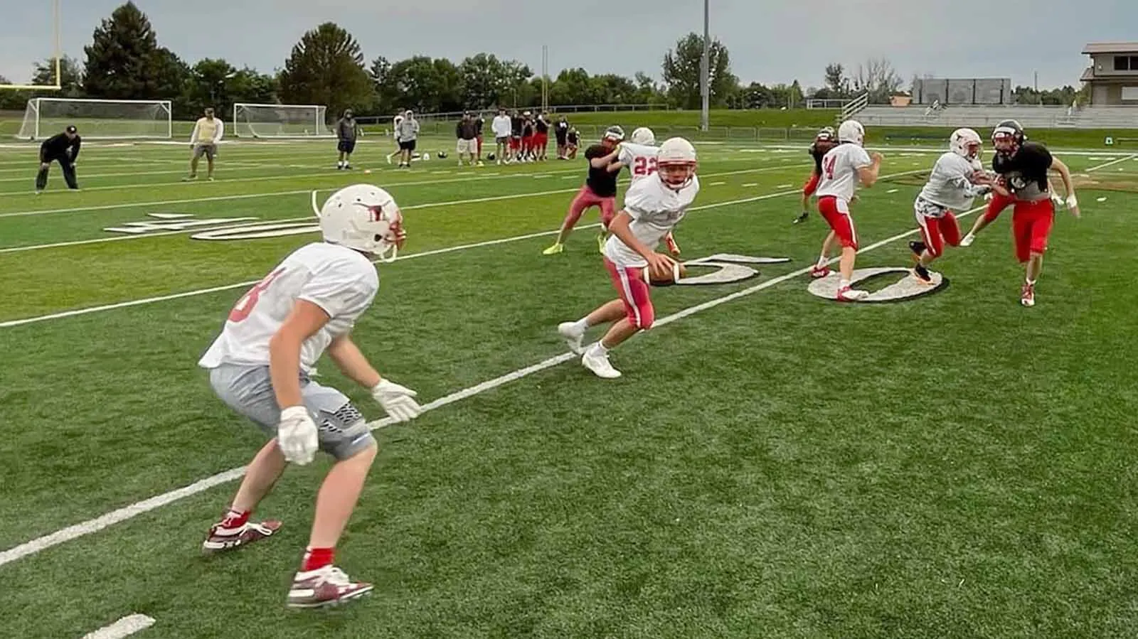 Players for the Meeteetse High School 6-man football team during a 2022 practice. The school doesn't have the numbers to field a team this season.
