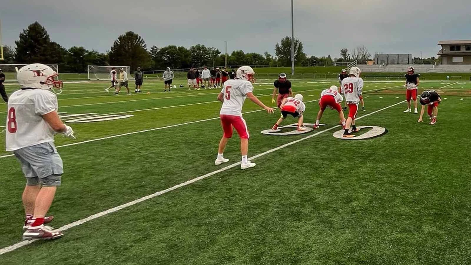 Players for the Meeteetse High School 6-man football team during a 2022 practice. The school doesn't have the numbers to field a team this season.