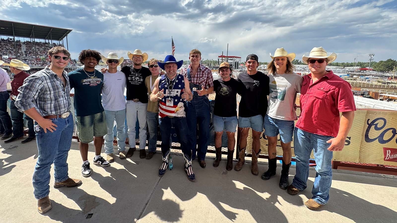 Members of the Northern State and University of Jamestown football teams visited Cheyenne Frontier Days at the invitation of Bryan Pedersen, center, this summer.