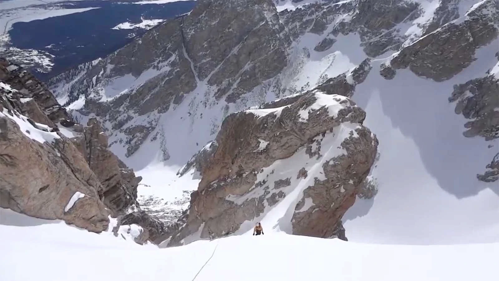 Looking down the Ford-Stettner Couloir in Grand Teton as a climber makes an ascent.
