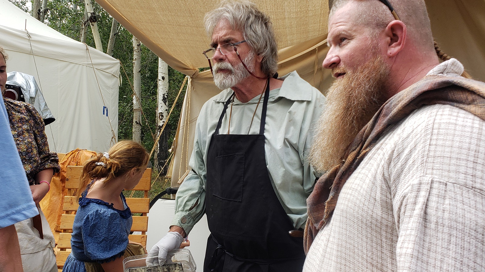 Craig Dinsdale uses a period correct camera to take tintype of participants at the Fort Bridger Rendezvous.