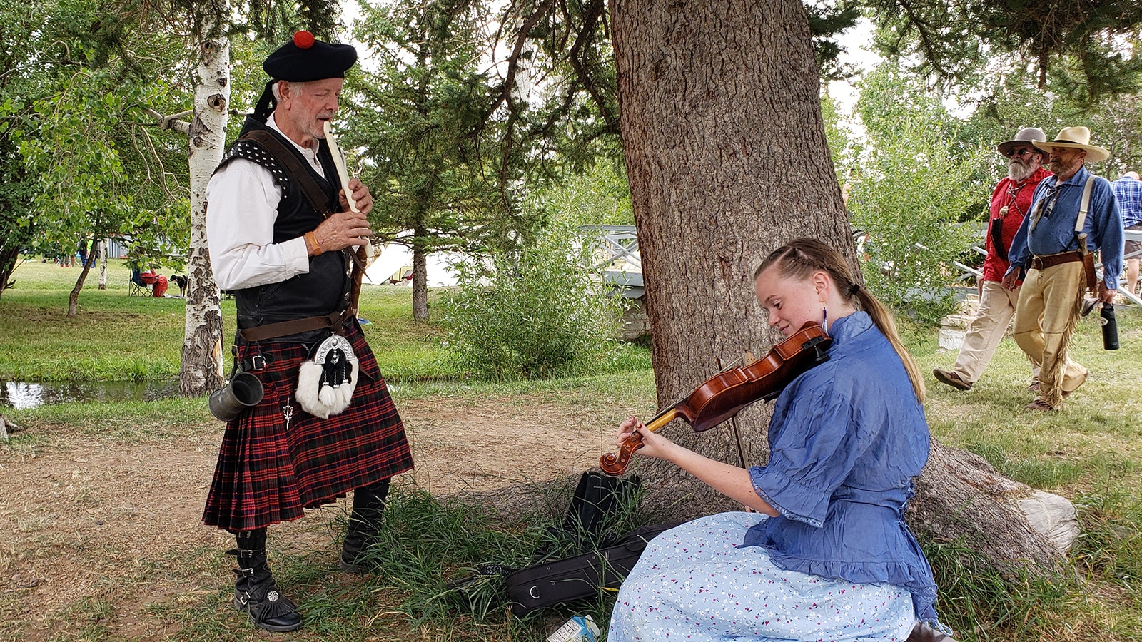 In a mashup of cultures, a Scottish tin whistle of old is played with a fiddle.