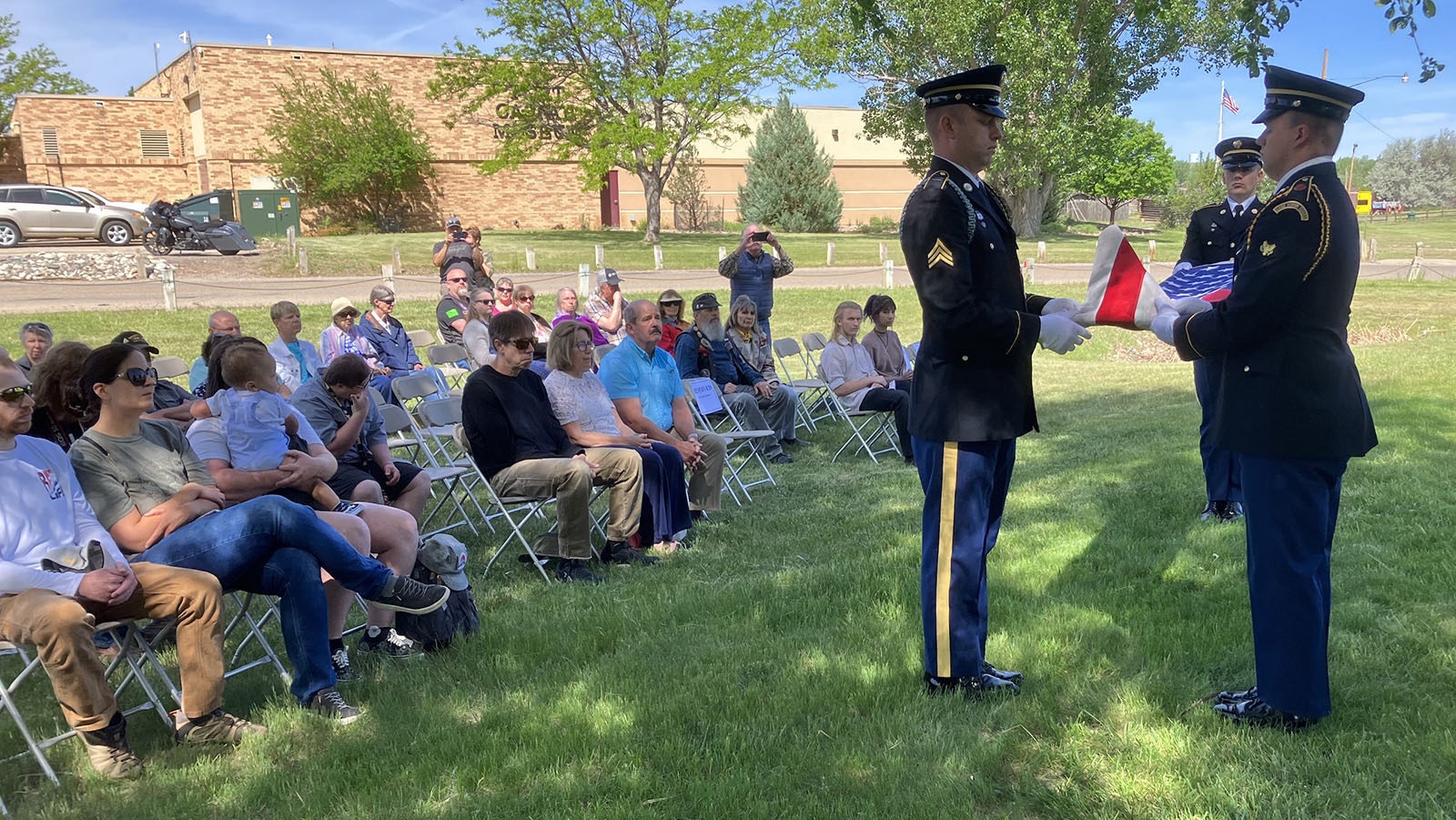 Members of the Wyoming Army National Guard perform a folded flag ceremony for the descendant of one of the 11th Kansas Volunteer Cavalry soldiers who died in 1865.