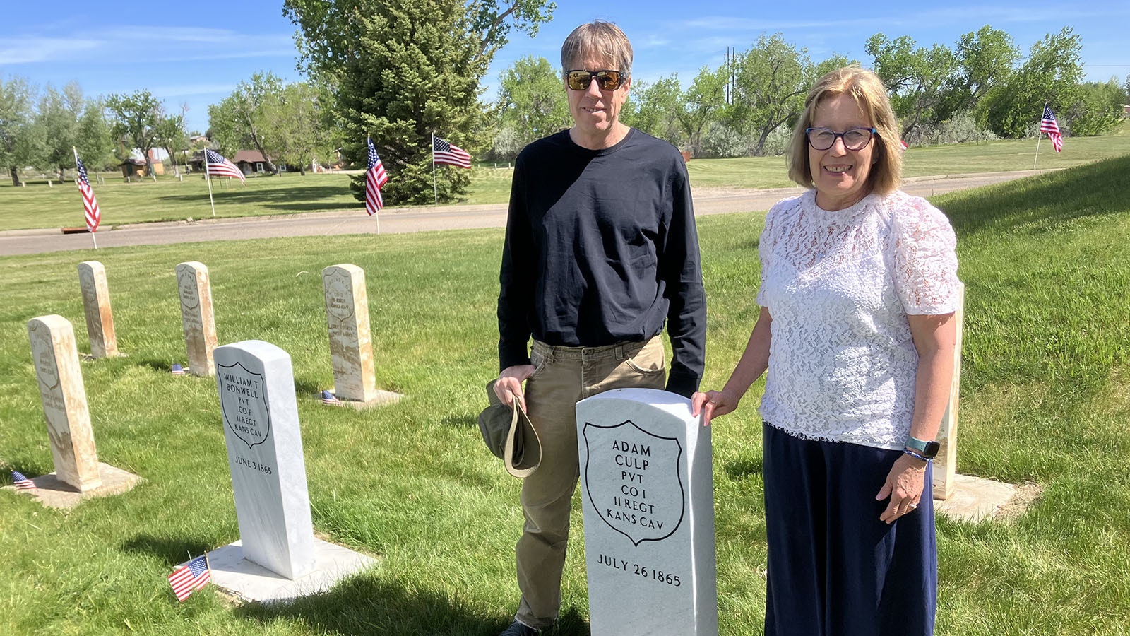 Brother and sister, Jim Baker and Elizabeth Jennings stand next to the commemorative headstone honoring their great-great-grandfather Francis’ brother, Adam Culp. Frances also served at Platte Bridge Station.