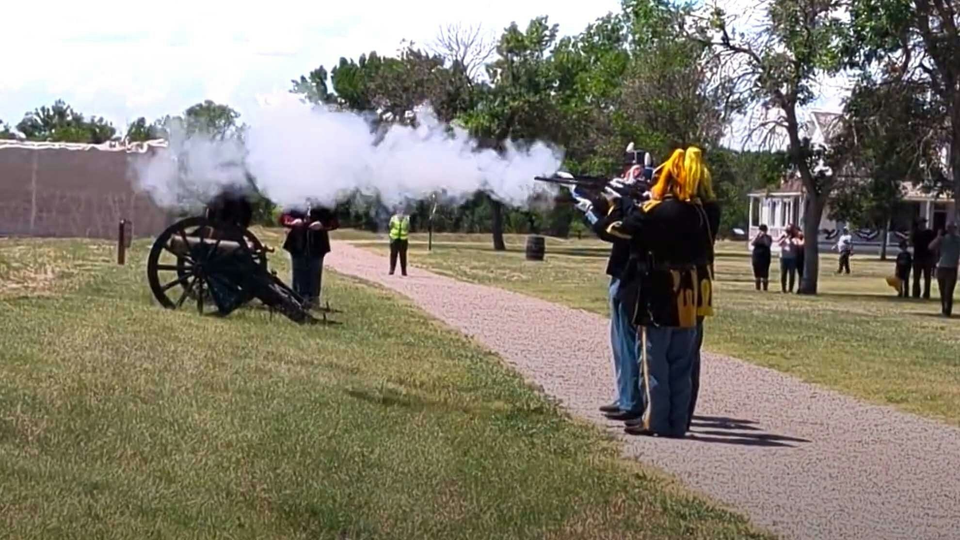 Rangers Jaret Carpenter, Rob Stevenson, Robert Cuvas and Jaeger Held fire blanks during a 38-gun salute held during Fourth of July celebrations at Fort Laramie National Historic Site.