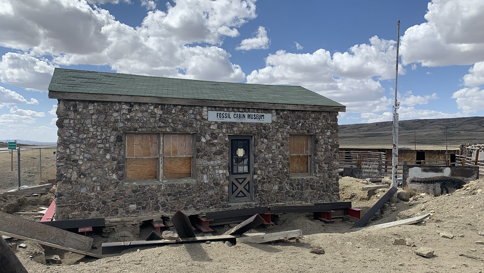 The Wyoming Fossil Cabin was supposed to be moved in 2018 from its current site along a remote section of Wyoming Highway 30 into Medicine Bow. But the project stalled, leaving the cabin resting awkwardly on beams.