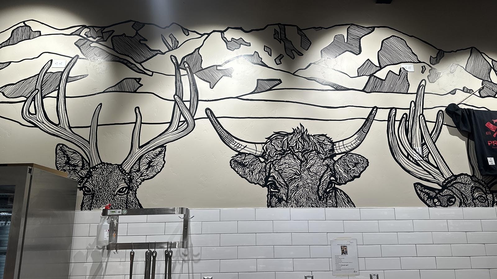 A Montana-inspired mural at Primal Meat & Fish Market.