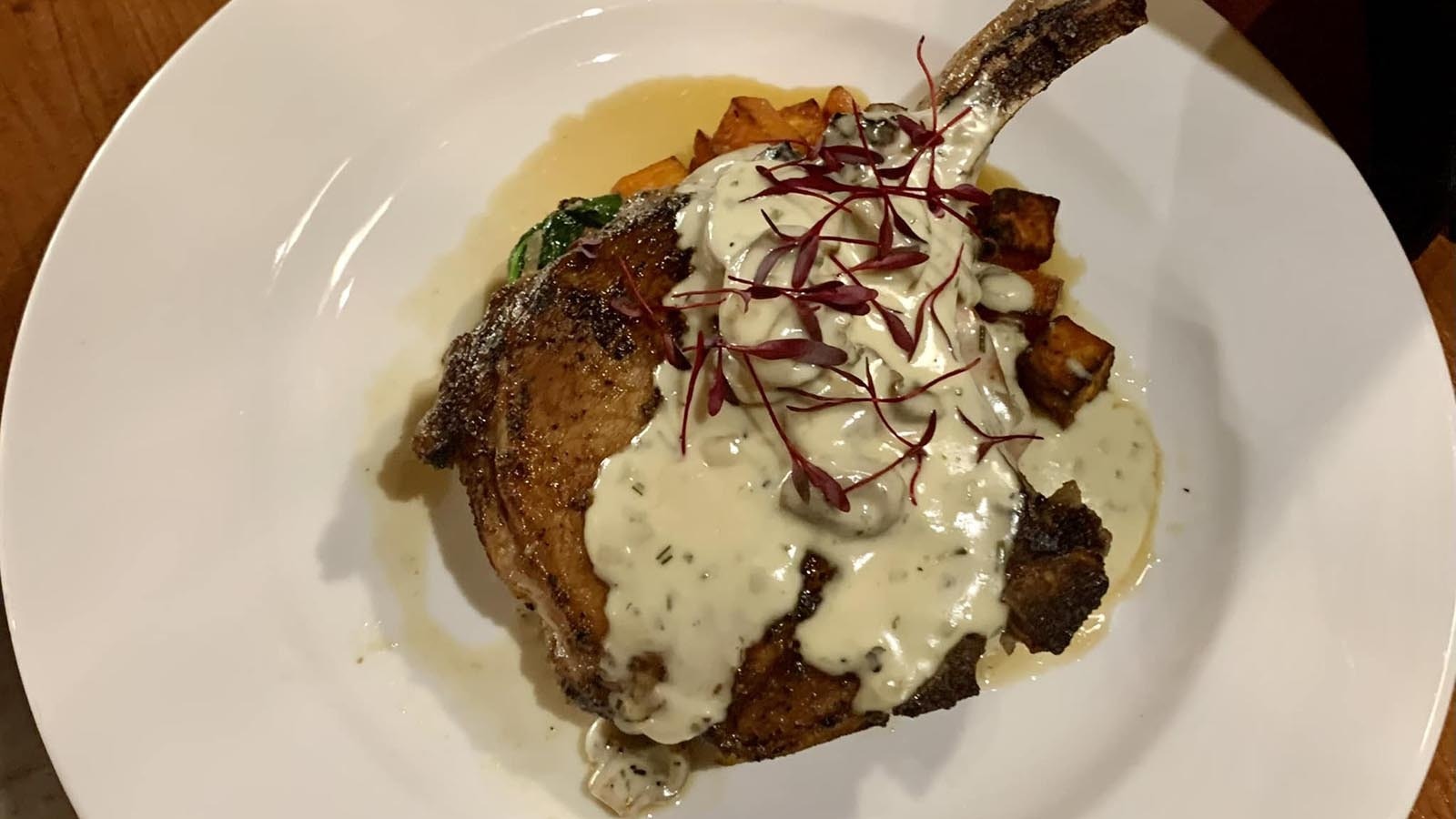 Double pork chop with rosemary mushroom cream sauce.