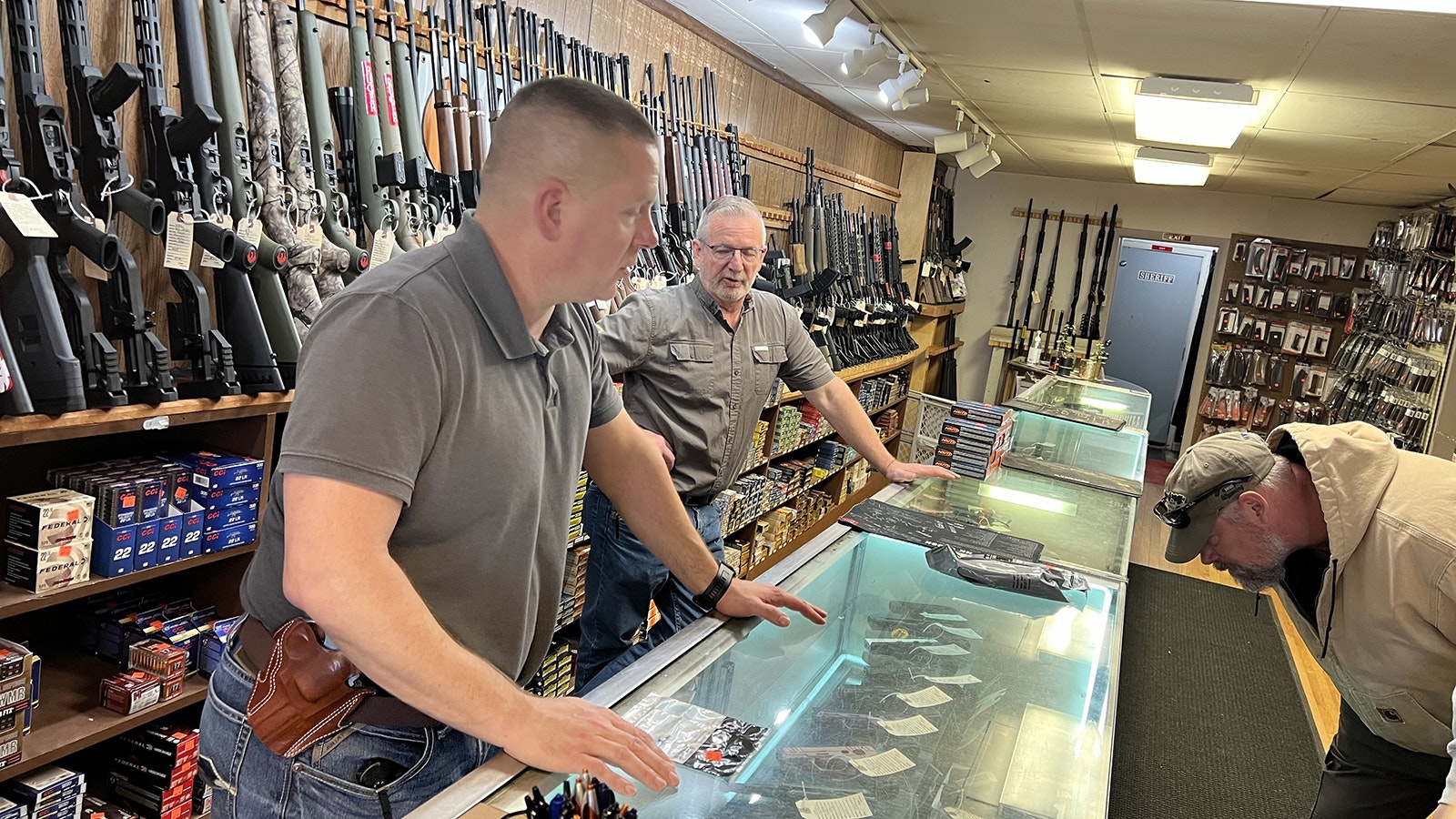 Ryan Allen, owner of Frontier Arms and Supply in Cheyenne, talks with a customer in this file photo.