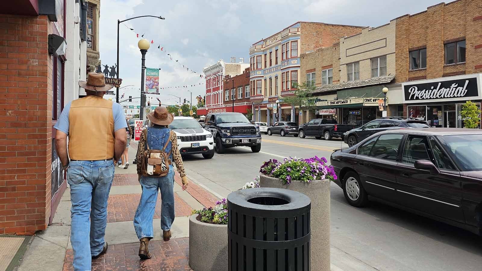 A couple of shoppers stroll down the streets in downtown Cheyenne.