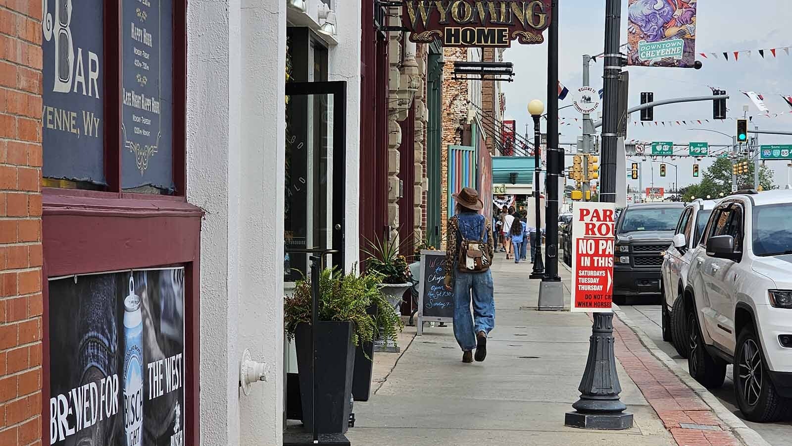 Shoppers stroll down the streets of Cheyenne, window shopping and browsing for western attire they can take home with them.