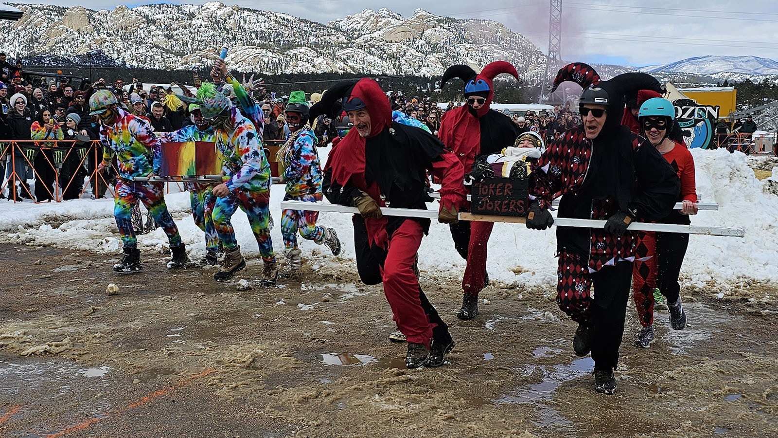 The Joker Tokens pull ahead of the Dead Heads during the Frozen Dead Guy Days Coffin Races.