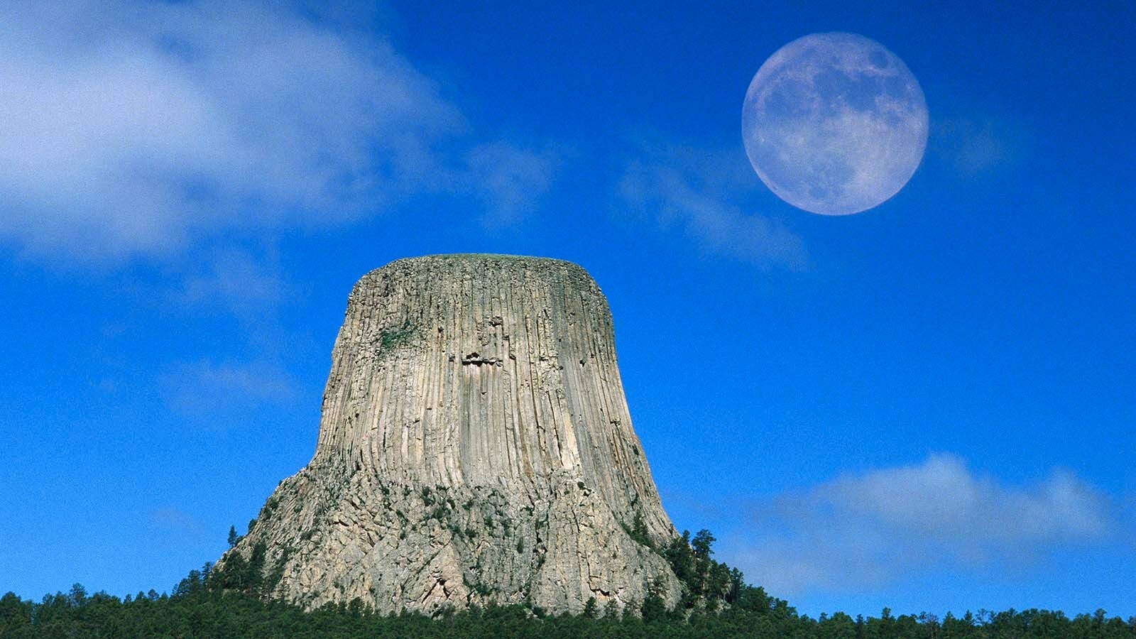 A huge full moon over Devils Tower, Wyoming.