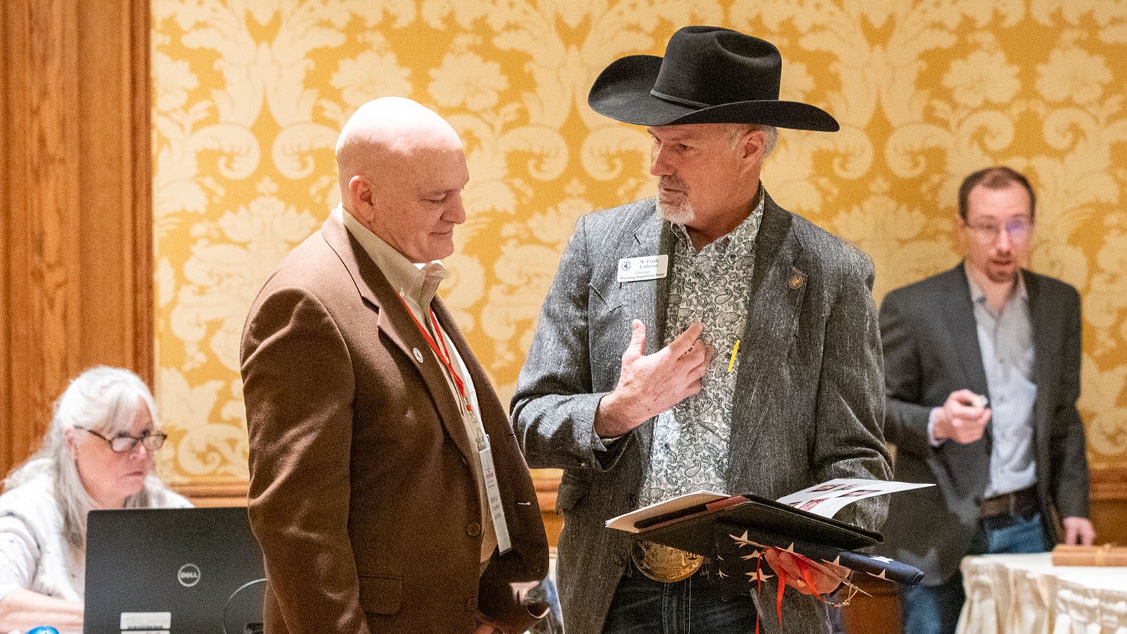 Rep. John Bear, R-Gillette, left, and Wyoming Republican Party Chairman Frank Enthrone talk Friday on the second day of the state GOP convention at Little America in Cheyenne.