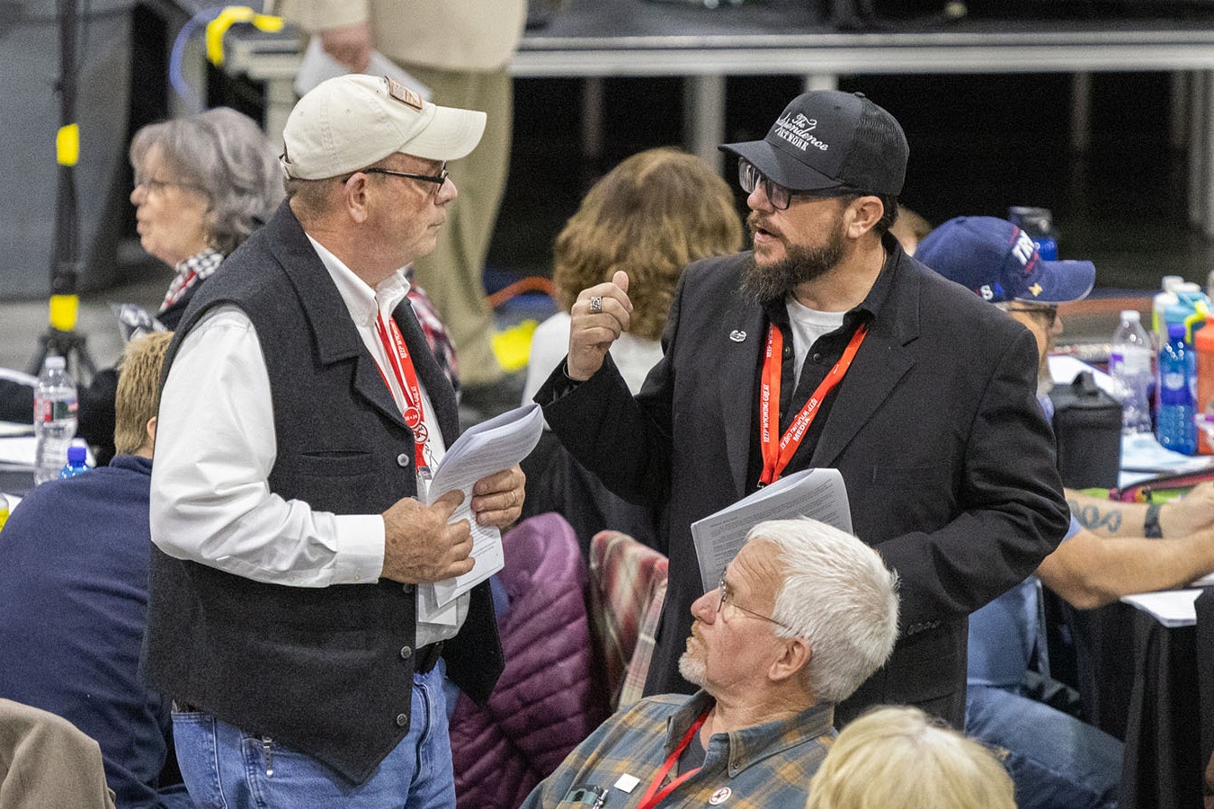 Park County delegate Vince Kanata, left, and Carbon County delegate Joey Correnti talk during the GOP state convention Saturday in Cheyenne. They came down on opposite sides of a debate about whether to allow parties to remove precinct committee members who miss too many meetings. Vanata supported the measure, which passed, while Correnti opposed it.