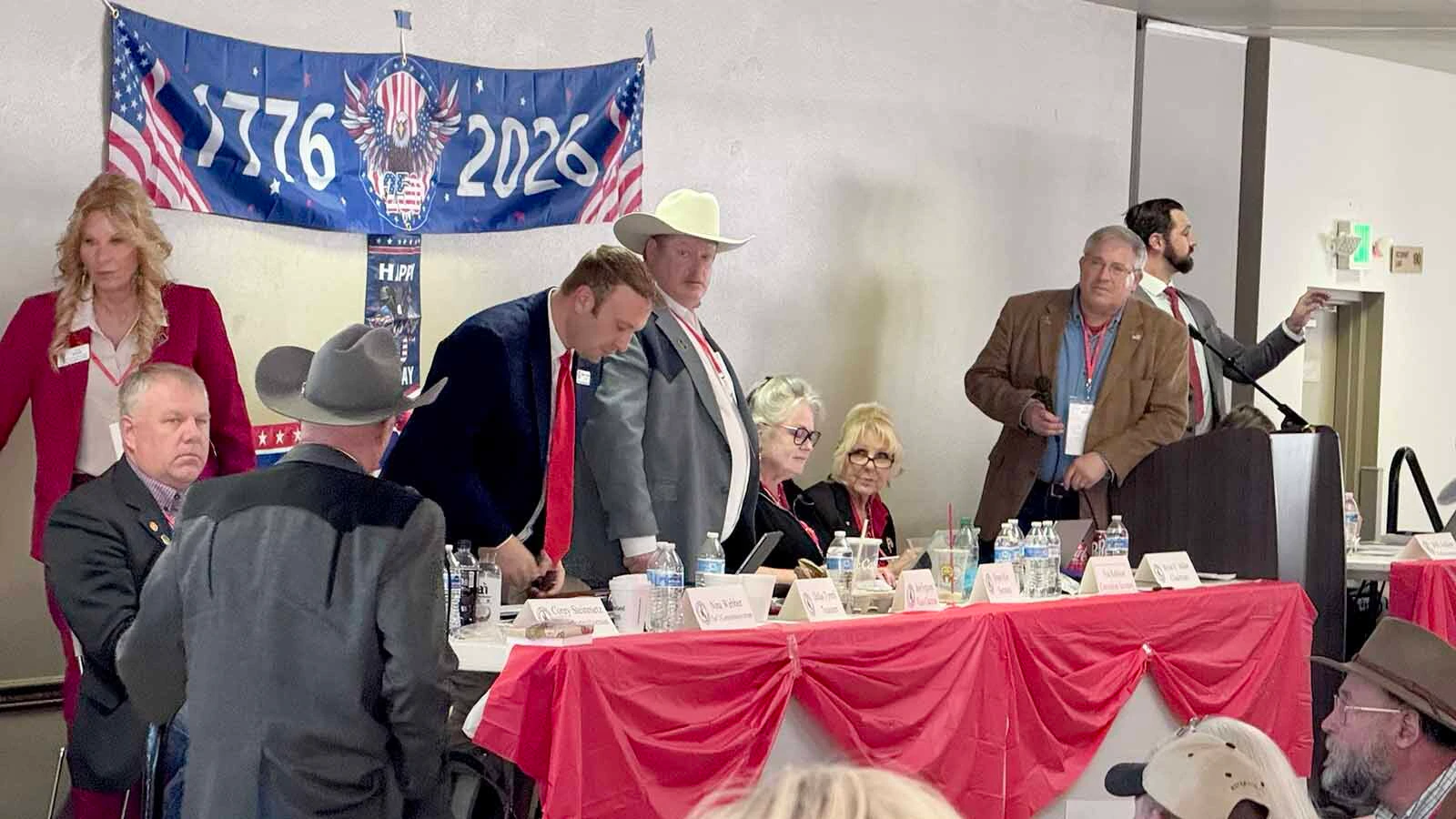 Wyoming Republican Party Chairman Bryan Miller, far right, listens to a delegate during Saturday's final day of the 2026 Wyoming Republican Party Convention on the state fairgrounds in Douglas.