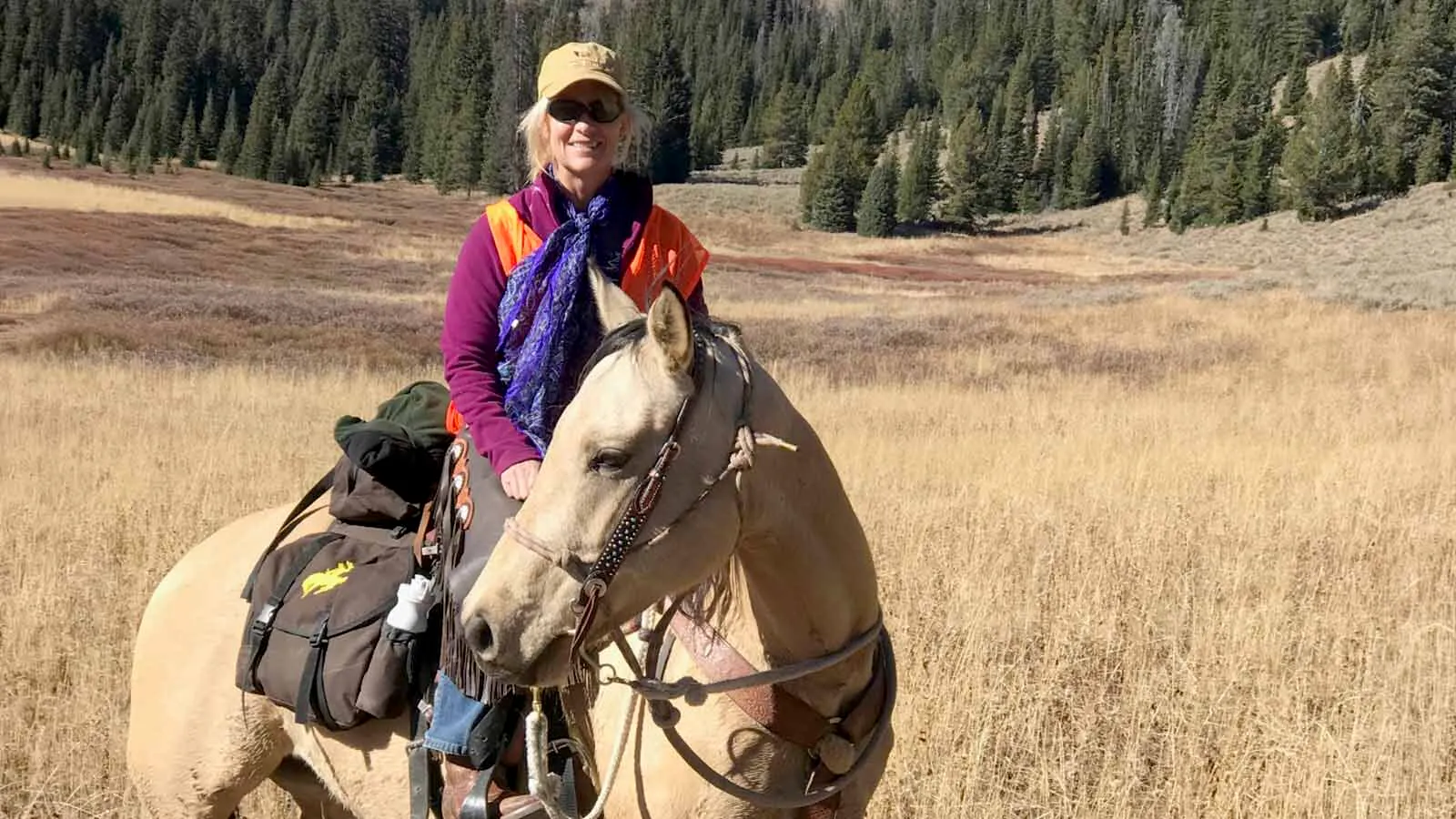 Gail Mahnke pauses on horseback during an outdoor ride.