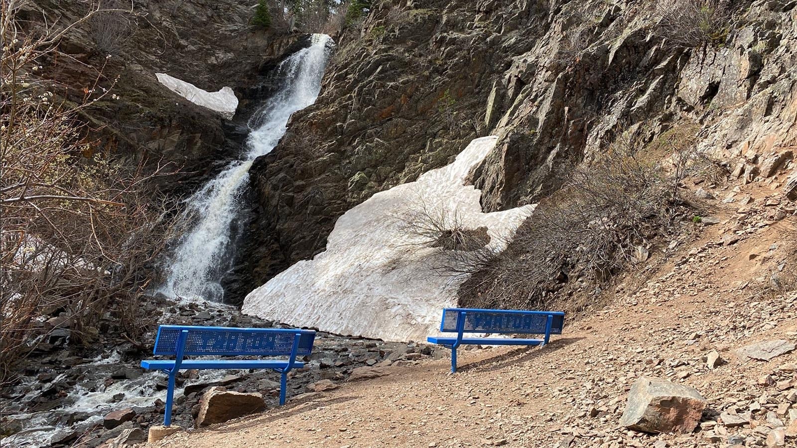 Blue benches dot the hike to the waterfall at Garden Creek Falls near Casper. The trail and falls are part of Rotary Park.