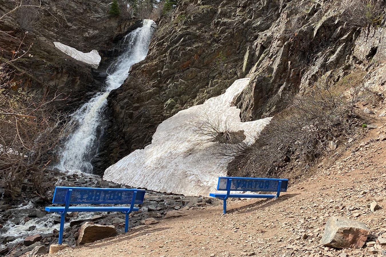 Blue benches dot the hike to the waterfall at Garden Creek Falls near Casper. The trail and falls are part of Rotary Park.
