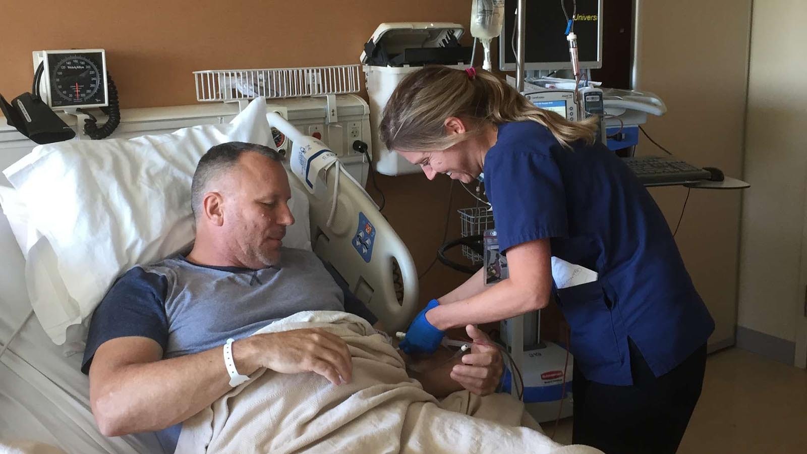 While Cheyenne police officer and Hall of Fame athlete Tom Garrison battles leukemia while undergoing chemotherapy, his partner Lori Millin has served as his caregiver and their faith and deep love have helped carry Garrison to remission.