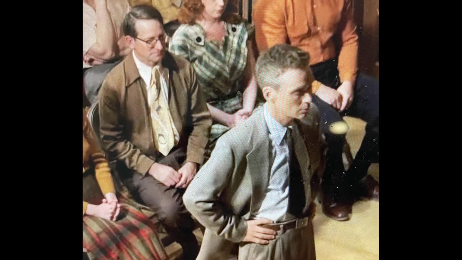 Garth Dowling sits behind Cillian Murphy in a scene from "Oppenheimer."