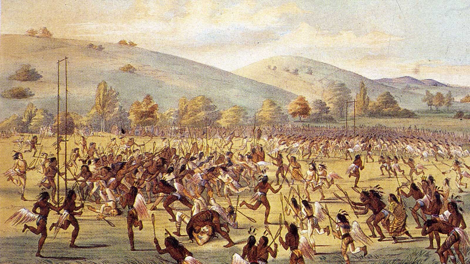 Men of the Choctaw tribe playing the traditional ball game with rackets and tall goalposts in this 1835 painting by George Catlin. Hundreds of players can take part in one game, and other members of the tribe lay extravagant bets on the outcome.