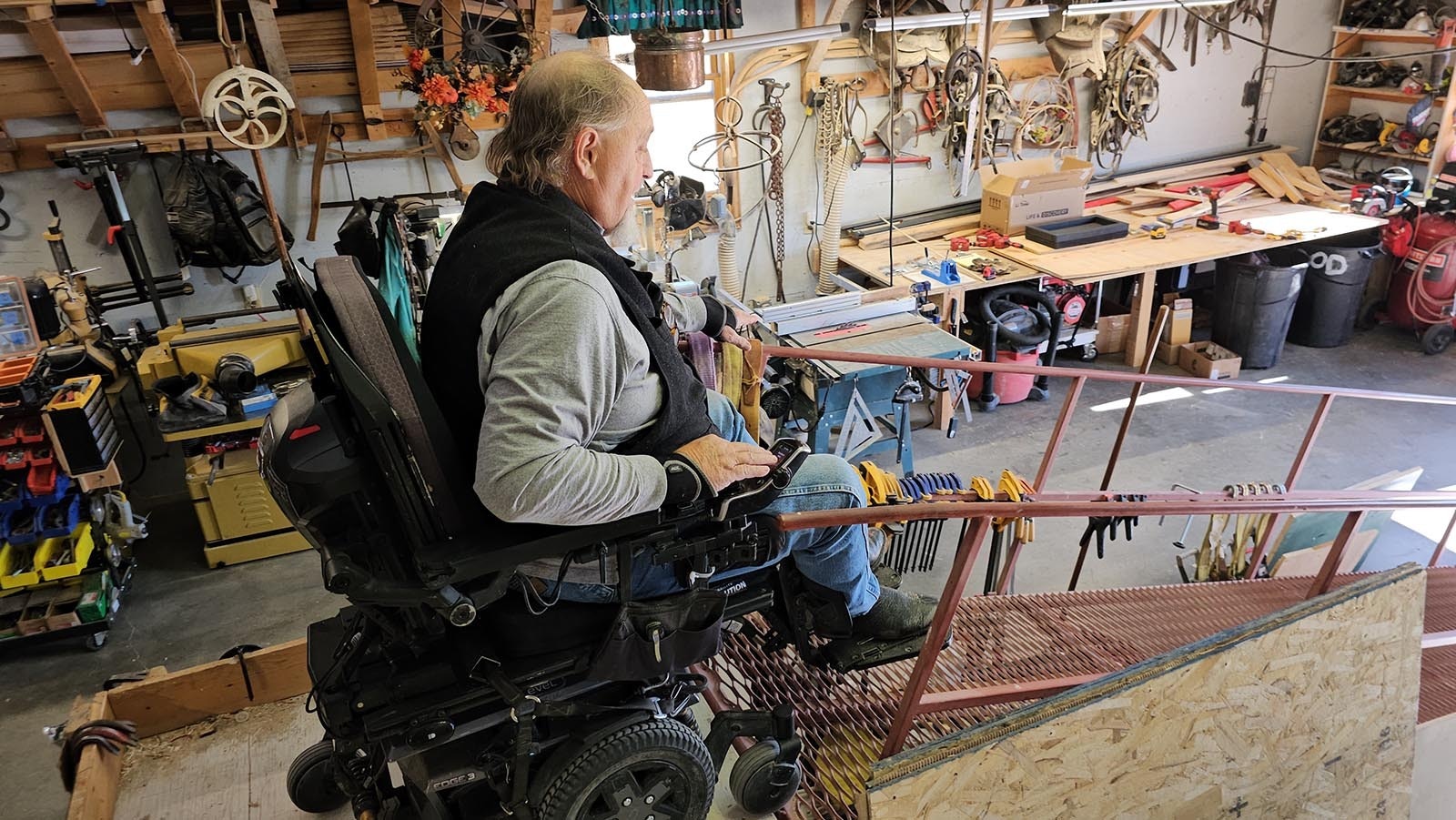 George Clark rides down the ramp that leads to a platform where he accesses the sheep wagons he builds.