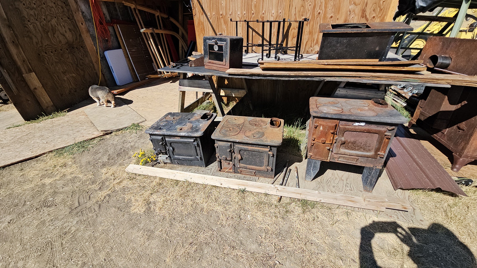 Wood stoves in various stages of restoration for sheep wagons.