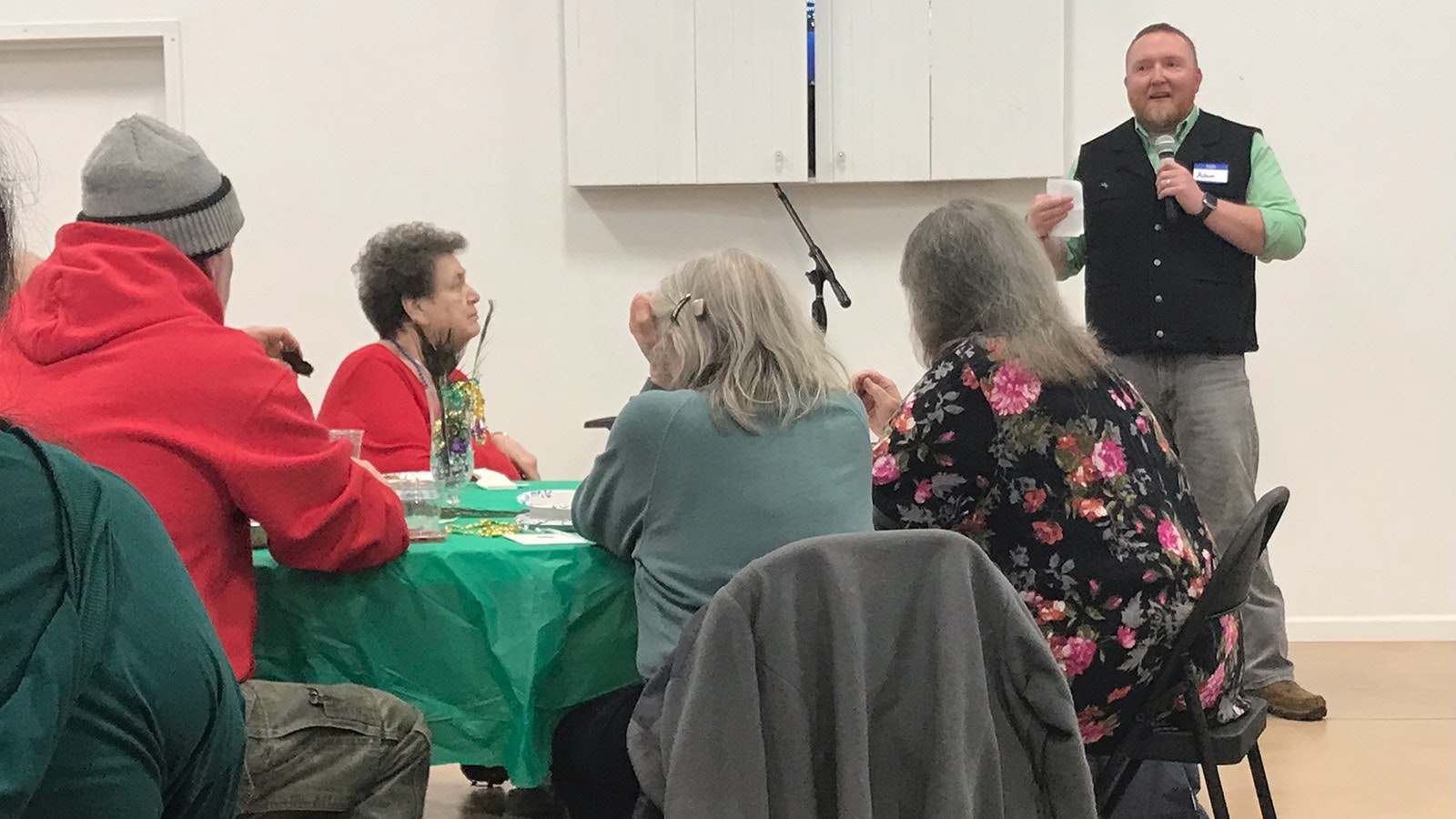 Thermopolis Mayor Adam Estenson speaks during a Mardi Gras get-together hosted by the Hot Springs County Democratic Party and also attended by local Republicans.