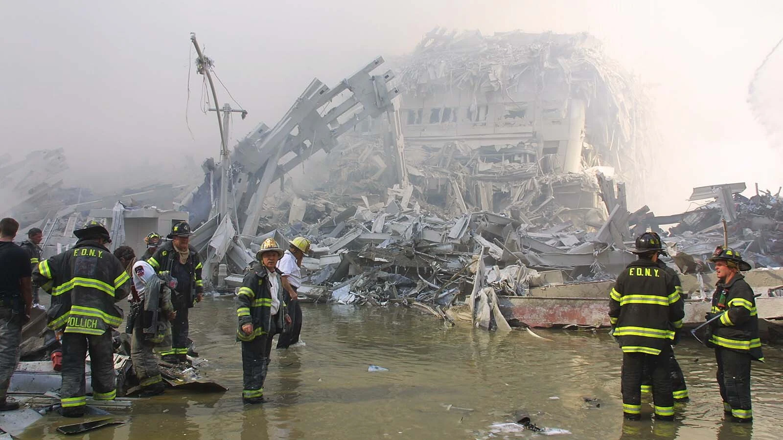 New York City firefighters work at the World Trade Center after two hijacked planes crashed into the Twin Towers on Sept. 11, 2001, in New York. Michael Hingson, who is blind, and his guide dog Rosalie survived.