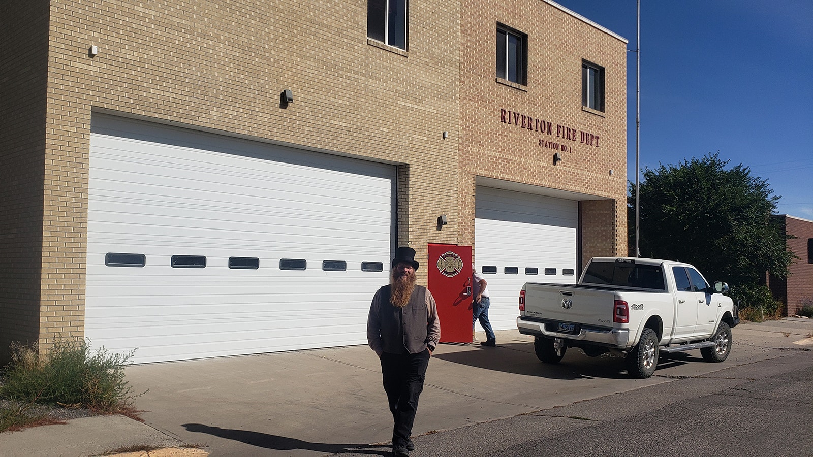 Alma Law poses in front of the Riverton Fire Department, where some report hearing ghostly music.