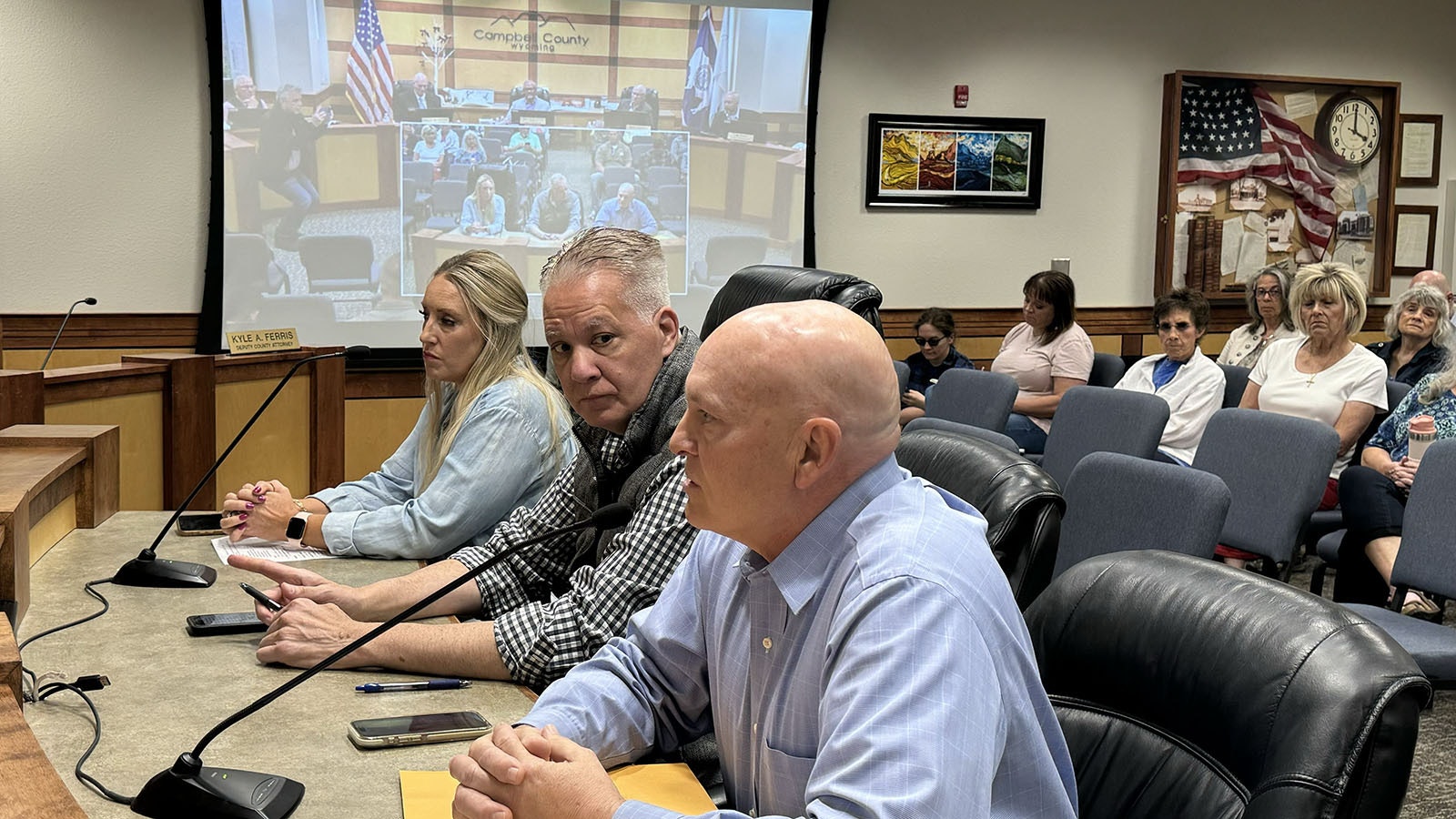 From left, Wyoming lawmakers Abbie Angelos, R-Gillette, Rep. Chris Knapp, R-Gillette, and Rep. John Bear, R-Gillette, who also is chairman of the Freedom Caucus, testify before the Campbell County Board of Commissioners about their opposition to a proposed Bureau of Land Management rule that would end coal mining on public lands by 2041. Bear said that the plan ignores basic “science, economics, and common sense.”