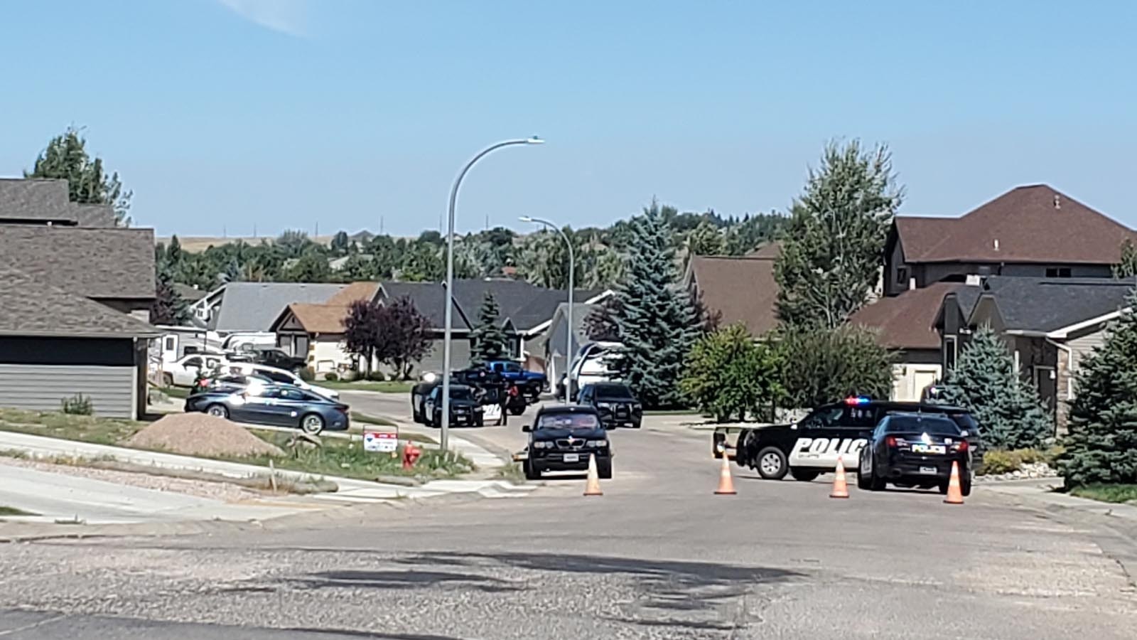 Police and emergency responders are positioned on Lexington Avenue in Gillette on Aug. 24, 2024, in response to a standoff-style situation.