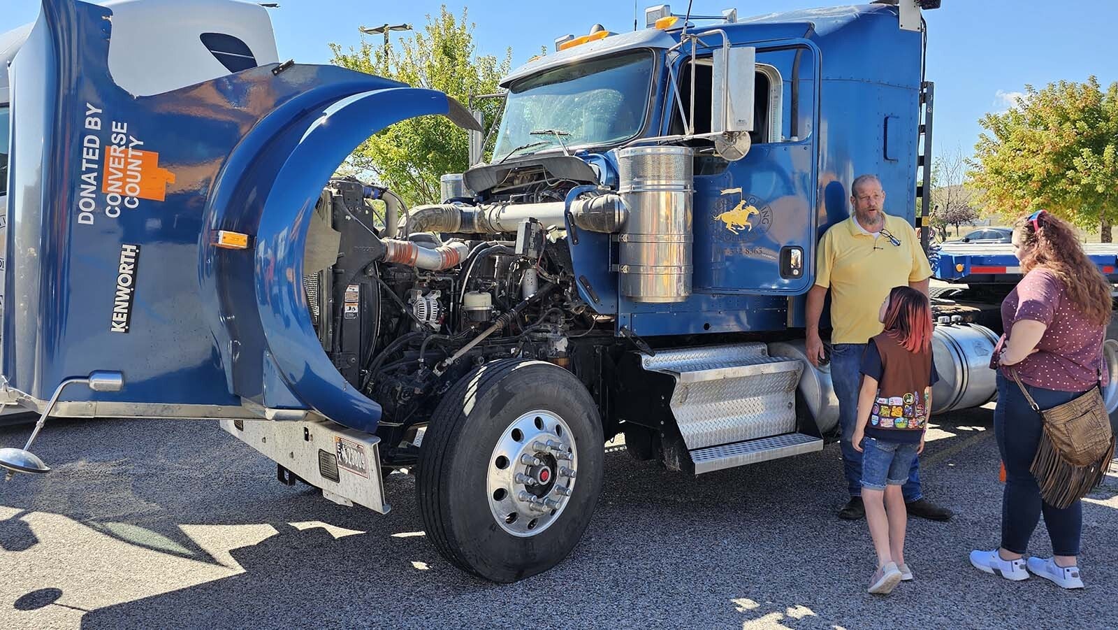 Heidi Moore, right, and Lydia Tripp, front center, learn more about trucks  during the annual Trucks Are For Girls Event, held every fall, at Eastern Wyoming College's Douglas campus..