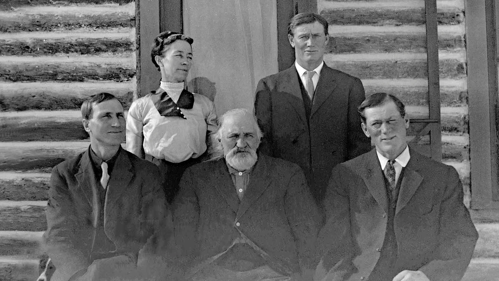 Elias Thurmond (center) and his children (clockwise from left) Henry, Annie, John and Charles in 1913 in front of Charles and Emily's two-story log house on the North Fork ranch.