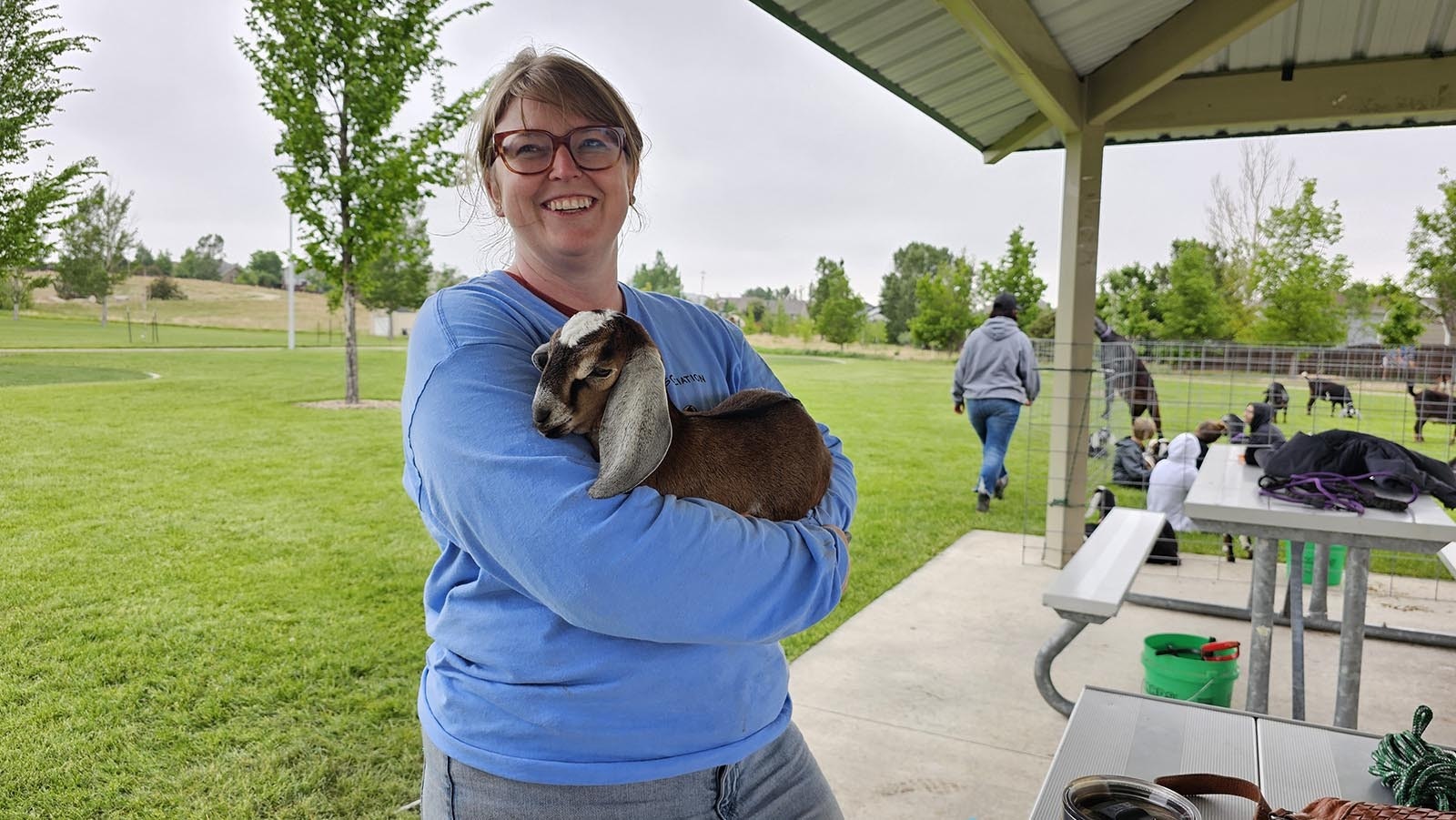 Wyoming Dairy Goat Association Vice President Caitlin Argyle holds a baby goat at Sun Valley Park.