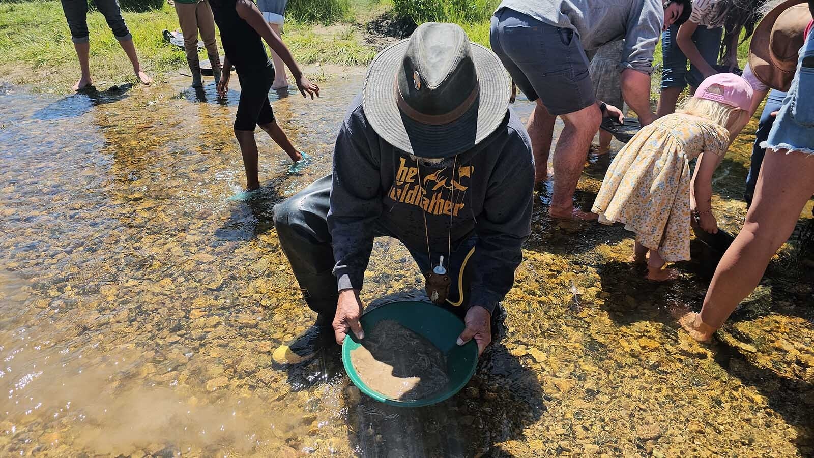 Larry Rohde demonstrates panning for gold at South Pass City during Gold Rush Days.