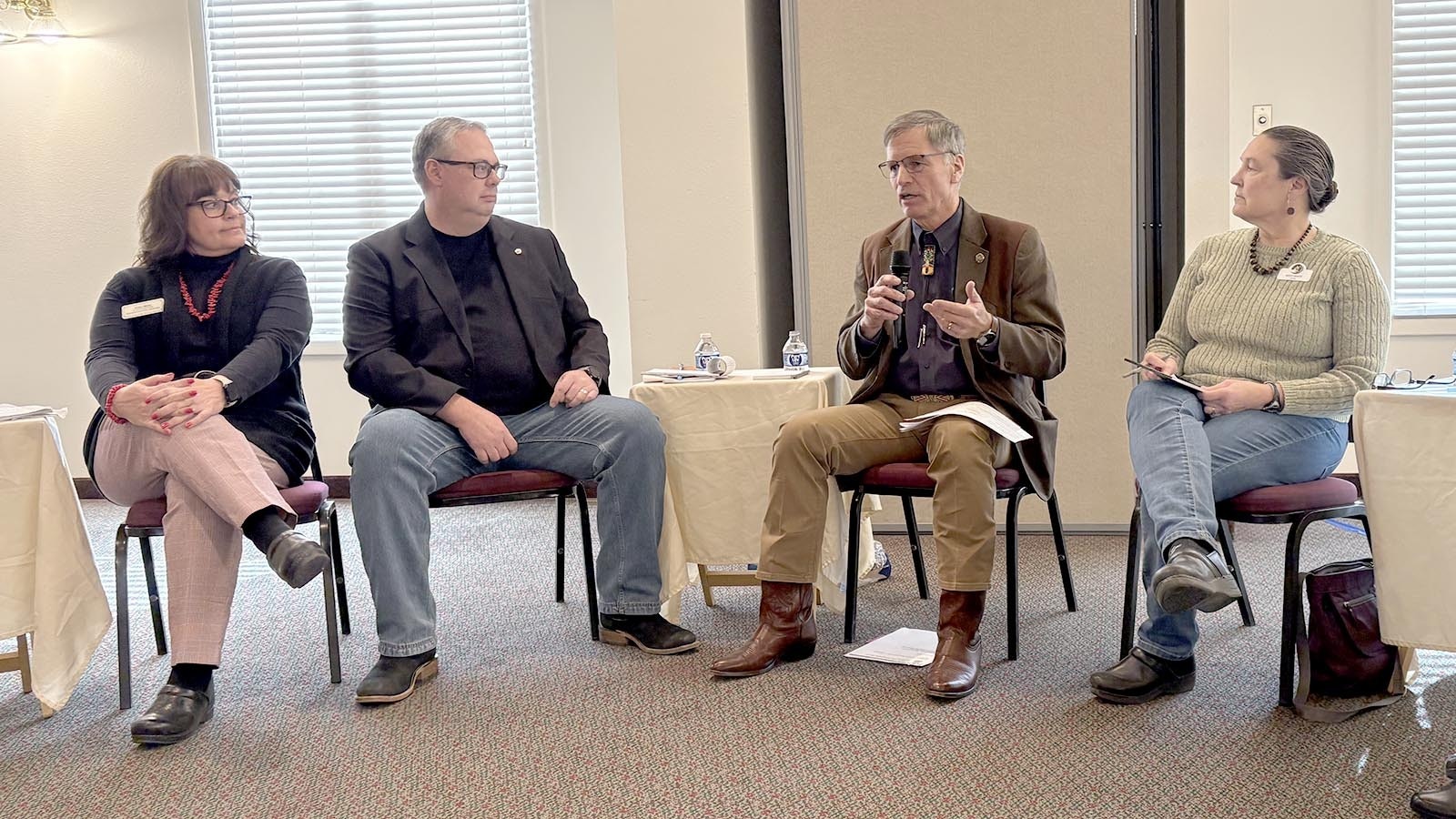 Fremont County Assessor Tara Berg, from left, businessman Cade Maestas, Gov. Mark Gordon, and Lander Mayor Missy White at a public forum Tuesday at the Inn in Lander. They discussed Gordon’s proposed budget, the impact of recent property tax cuts and lawmakers’ proposed budget cuts and denials.