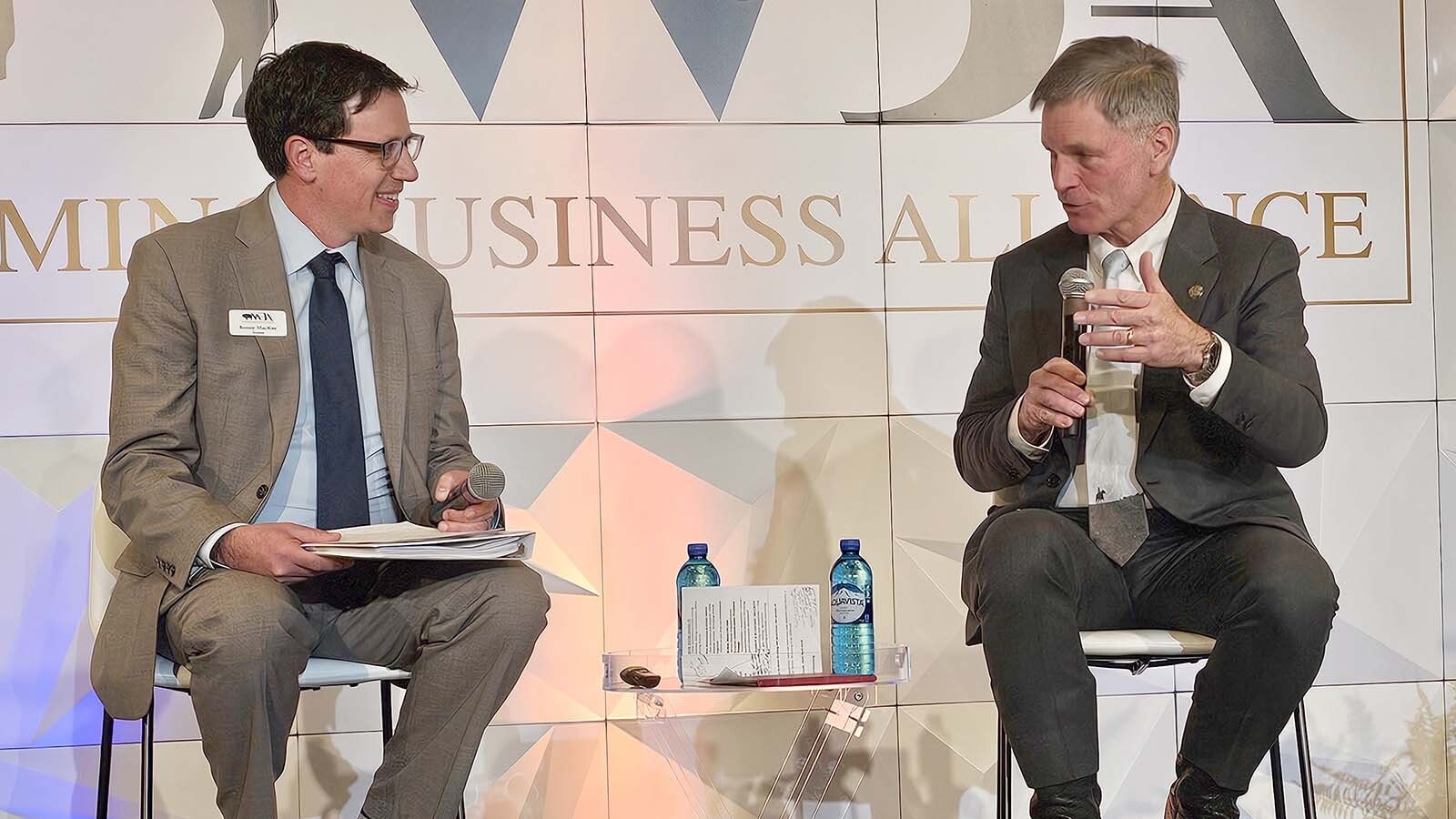 Gov. Mark Gordon, right, talks with Wyoming Business Alliance President Renny MacKay during the Wyoming Business Alliance Annual Governor's Conference.