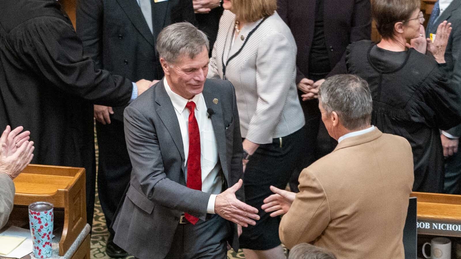 Gov. Mark Gordon greets legislators at the begining of the 2025 session at the Capitol in Cheyenne.