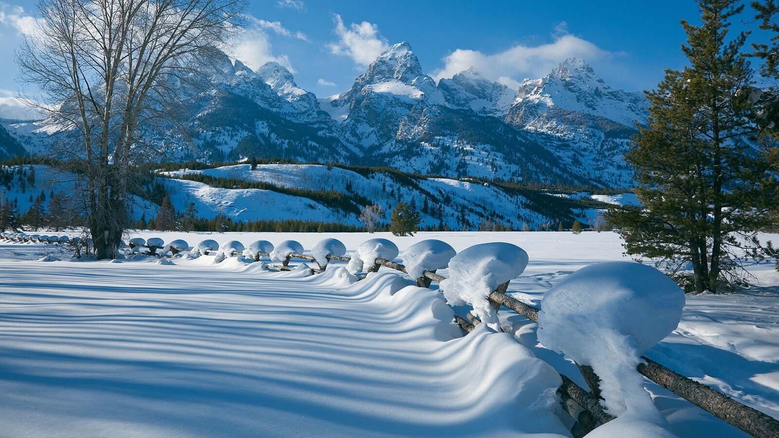 While much of Wyoming is experiencing record warmth and dryness, the mountains in western Wyoming are buried in snow. The snowpack is between 90% and 143% of average in what meteorologists say is a pattern where record-breaking warmth is building stellar snowpack. 