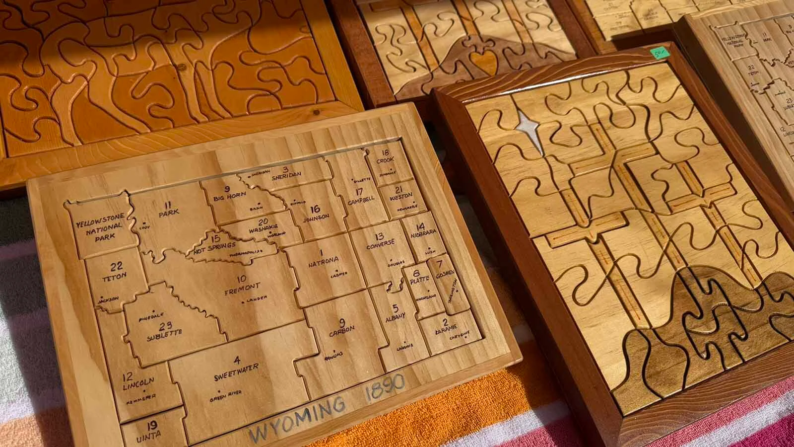Grandpa's Toys and Creations specializes in making wooden toys and puzzles out of repurposed wood to keep the prices affordable. Teachers are big fans of his county map puzzle while kids love the parade of colorful animals.