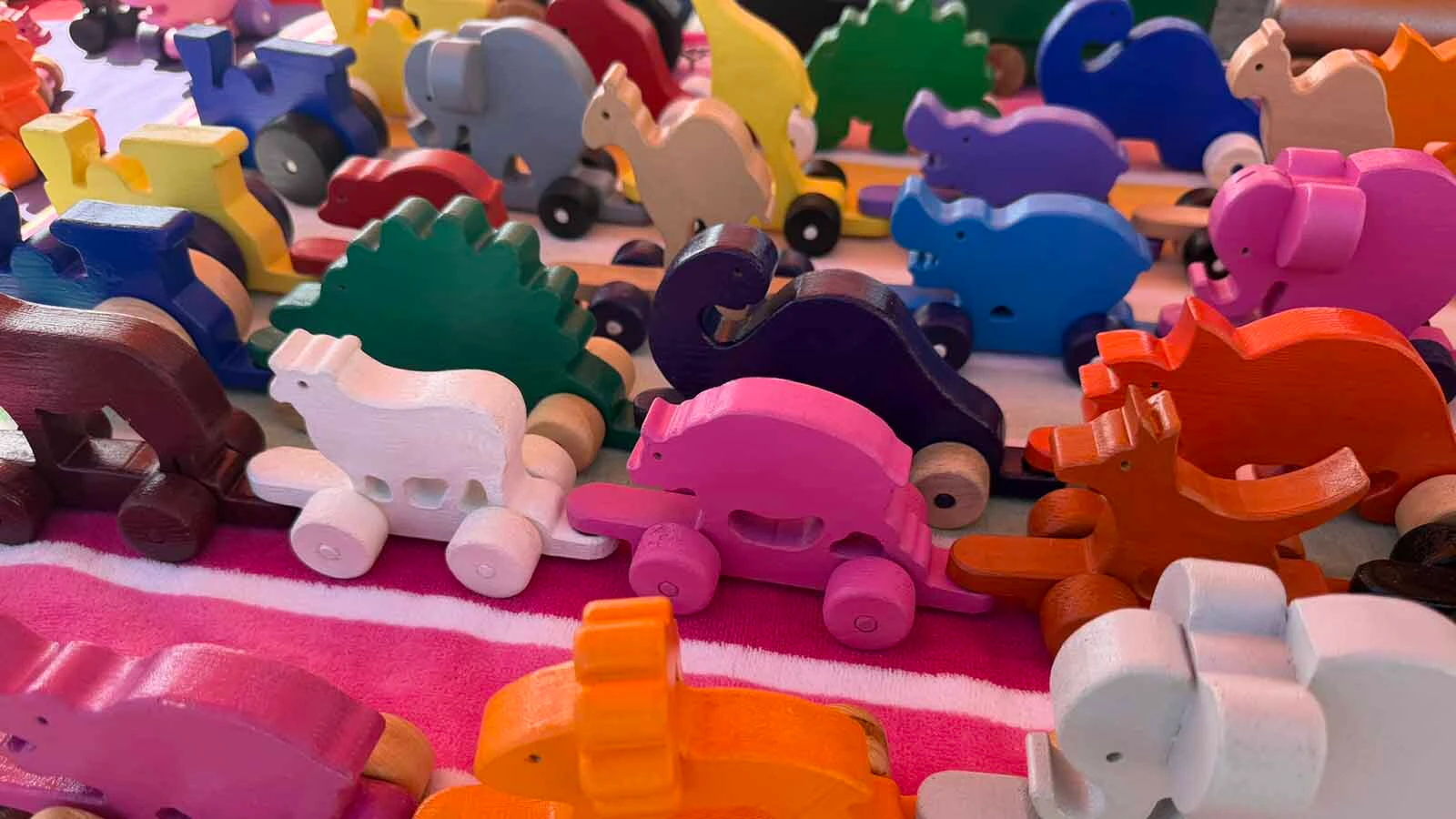 Grandpa's Toys and Creations specializes in making wooden toys and puzzles out of repurposed wood to keep the prices affordable. Teachers are big fans of his county map puzzle while kids love the parade of colorful animals.