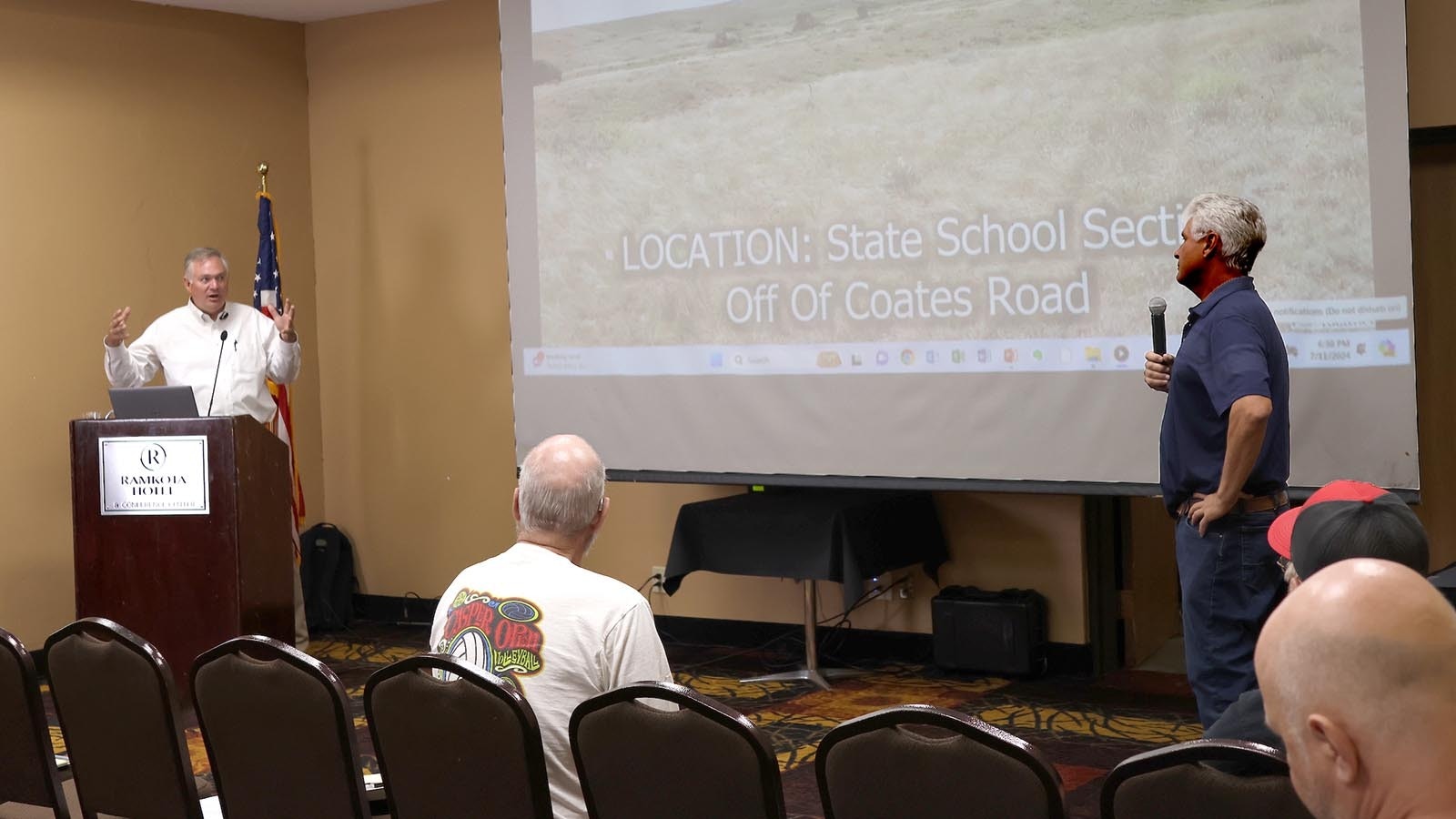 Prism Logistics Manager Kyle True, left, answers a challenge from Casper Mountain Preservation Alliance Member Chris Navarro.