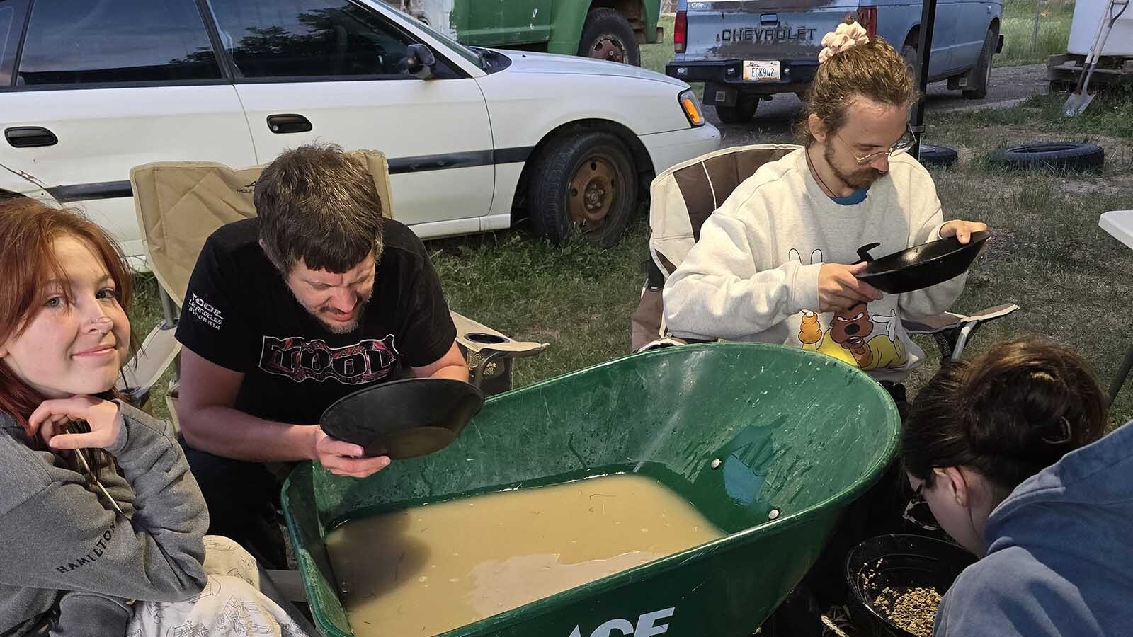 Brandon Parker and Melissa Absher got engaged on the Fourth of July, and Parker proposed with 100 pounds of sapphire gravel awaiting what turned into a panning party to find a sapphire for Absher's engagement ring.